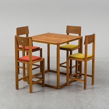 MARIO PRANDINA, an oak table and four chairs, Plinio Il Giovane, Italy.
