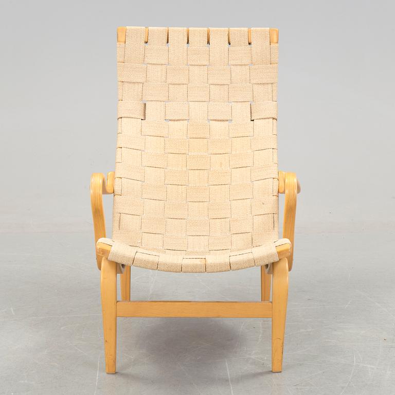 A BRUNO MATHSSON "PERNILLA 2, T. 107" BEECH AND WEBBING ARMCHAIR, Firma Karl Mathsson, Värnamo, Sweden, 1981.