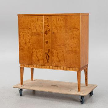 A birch wood veneered cabinet, first half of the 20th Century.