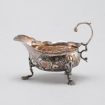 A silver sugar shaker, salt shaker and creamer, 19th-20th century.