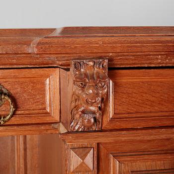 A cabinet in baroque style, made in the first half of the 20th century.