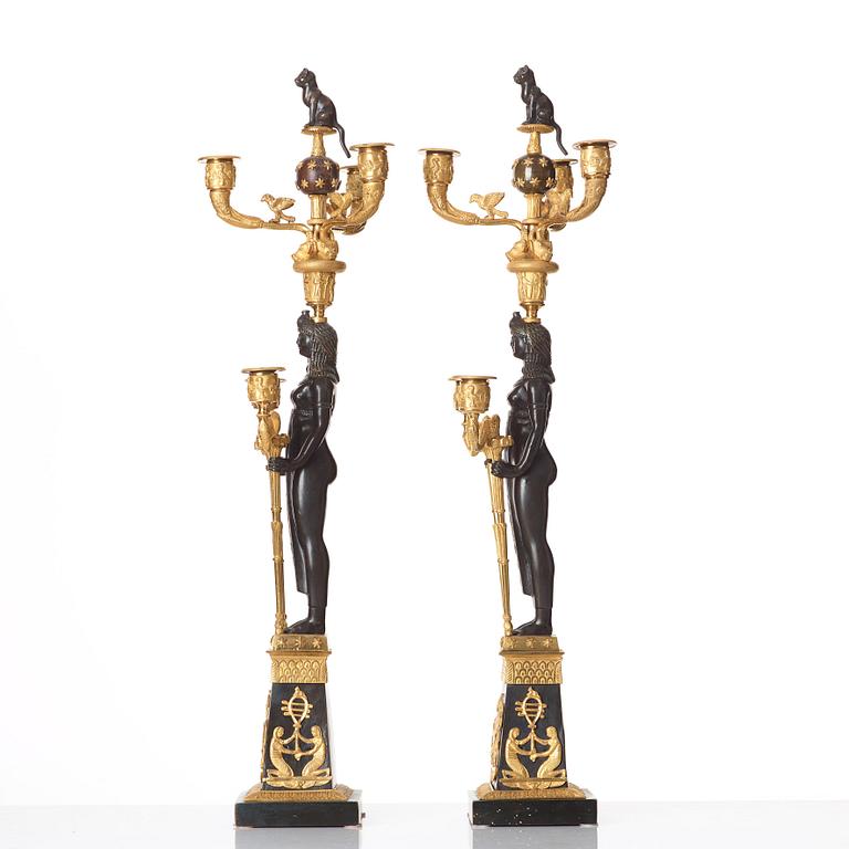 A pair of Russian Retour d'Egypte Empire Alexander I five-light candelabra, St. Petersburg.