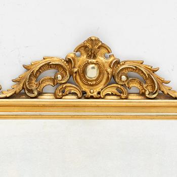 A rococo style mirror by AG Säfström Kristianstad from around the year 1900.