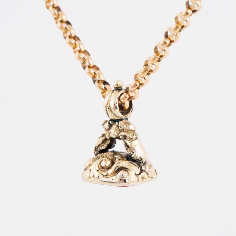 A carnelian seal in a chain.