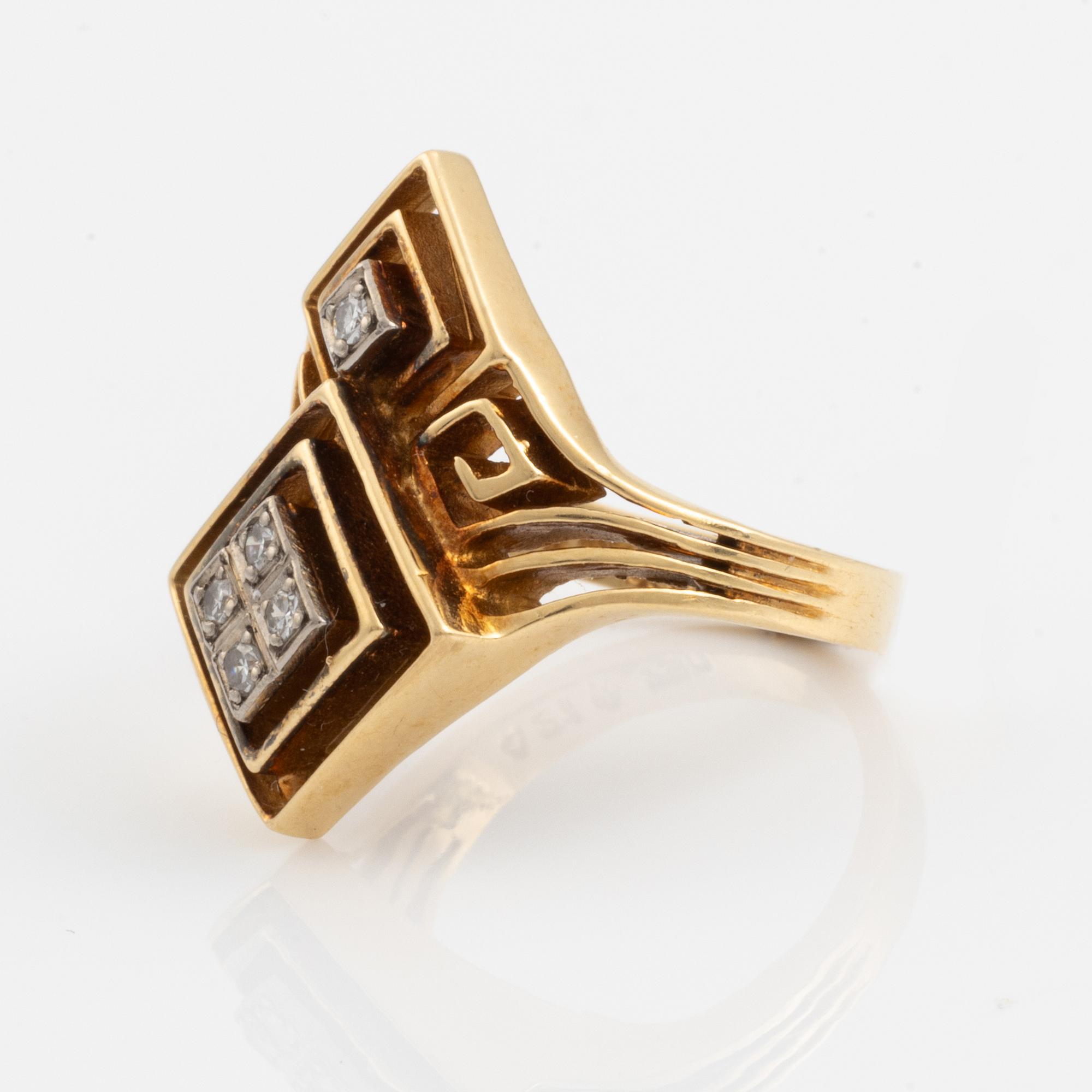 An Ilias Lalaounis ring in 18K gold set with eight-cut diamonds.