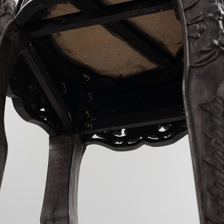 A Chinese wooden and stone table, 20th century.