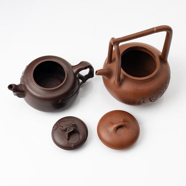Two Chinese yixing teapots, early 1900s and 1980s.