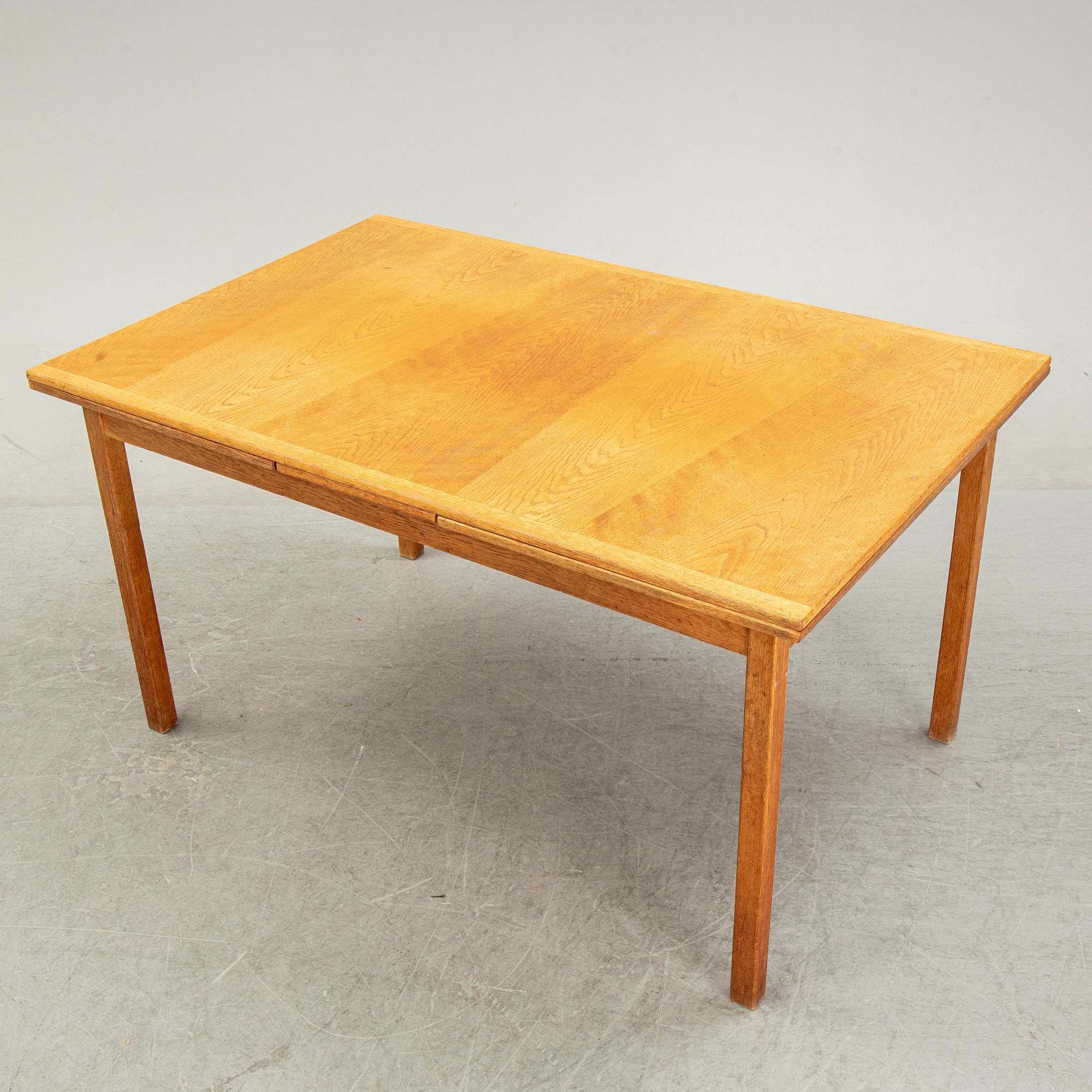 Knud Andersen, a set of six chairs for J.C.A Andersen, Aarhus, Denmark and a dinner table from Troeds, Bjärnum.