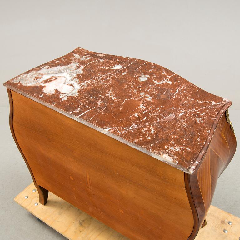 A Rococo-style chest of drawers, mid 20th century.