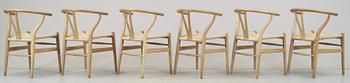 A set of six Hans J Wegner oak 'Wishbone chairs', Carl Hansen & Søn, Denmark.