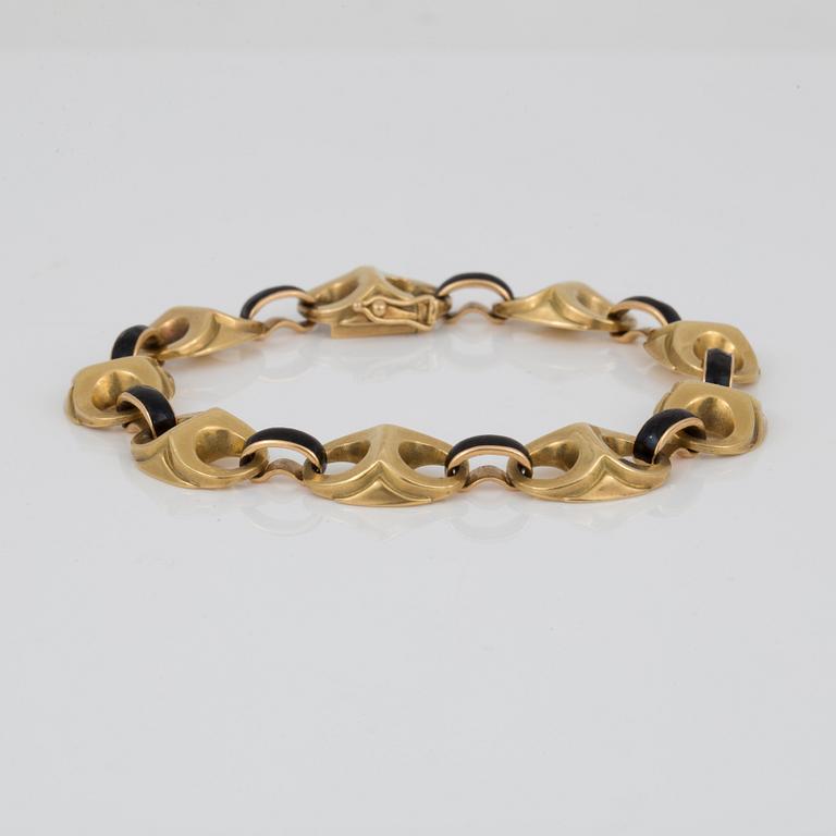 ARMBAND, ankarelänkar med svart emalj dekor, troligen 1800-talets slut, 18K guld.