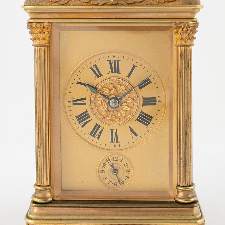 A French Brass and Glass Aiguilles Carriage Clock with Leather Case, first half of the 20th century.