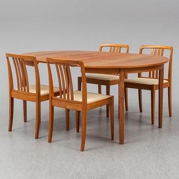 A 1950/60s teak and valnut table and four chairs.