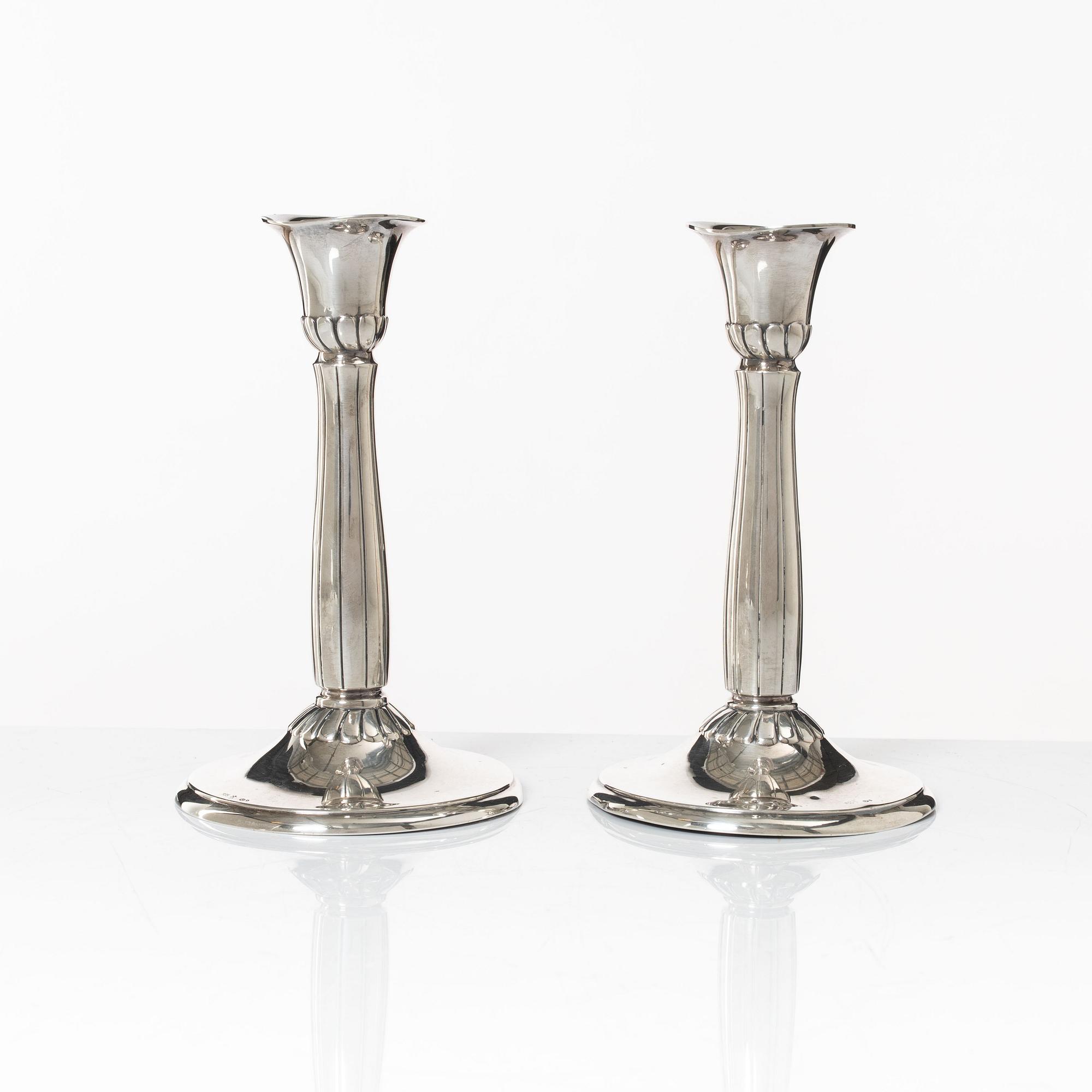 A pair of silver candle sticks, first half of the 20th century.