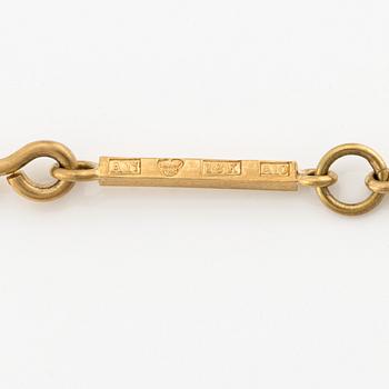 Wiwen Nilsson, an 18K gold necklace with a rock crystal pendant, Lund 1975.