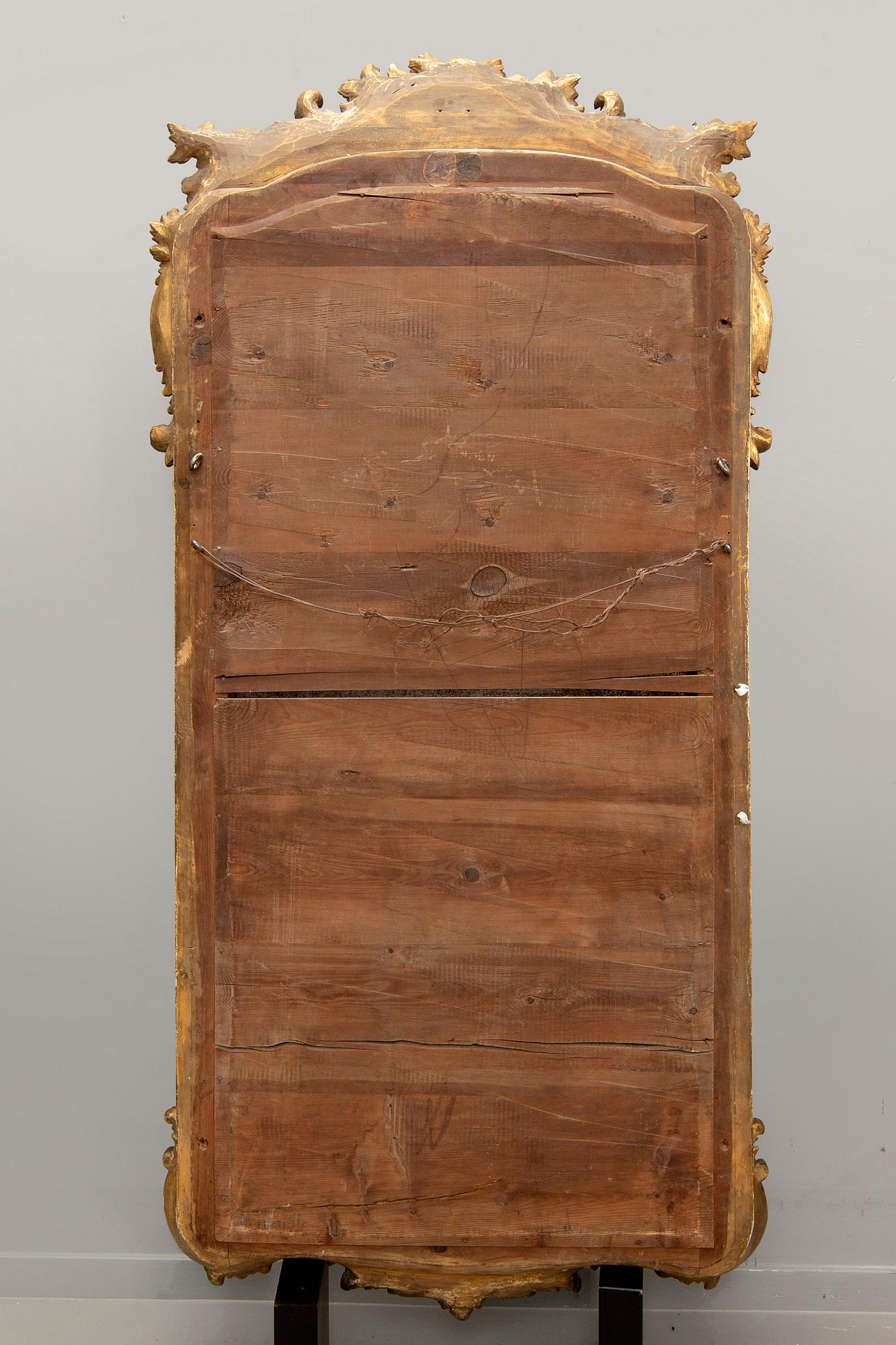 A Swedish Neo Rococo gilded signed mirror 1880s.