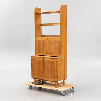 Göran Malmvall, a pinewood book case with secretaire and cabinet, second part of the 20th Century.