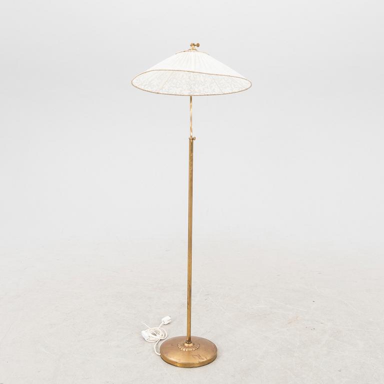 A 1940s brass  floor lamp.