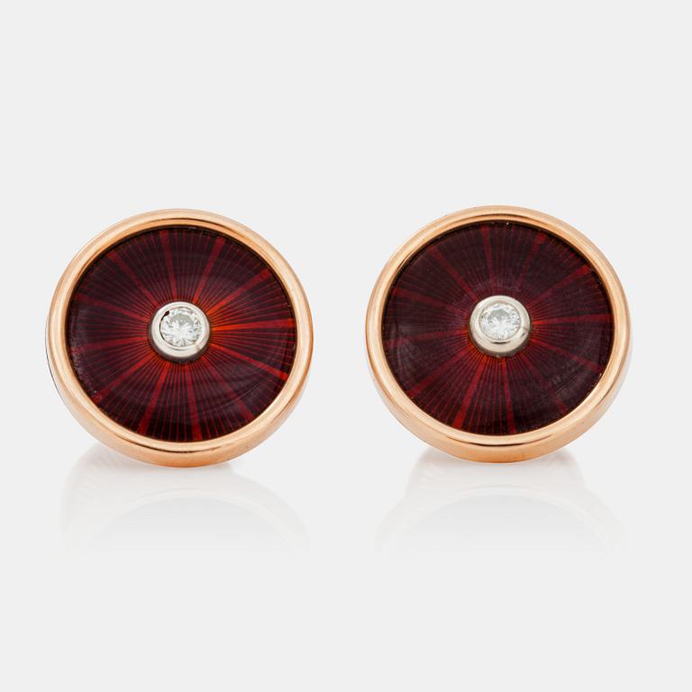 A pair of cufflinks, red enamel and brilliant cut diamond.