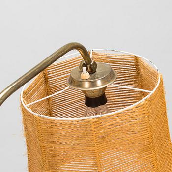 A 1950s floor lamp in brass.