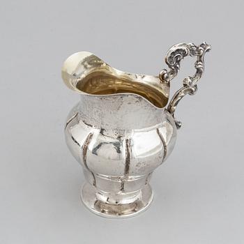 A Swedish 19th century parcel-gilt silver cream-jug, mark of Oskar Ahlström, Södertälje 1856.