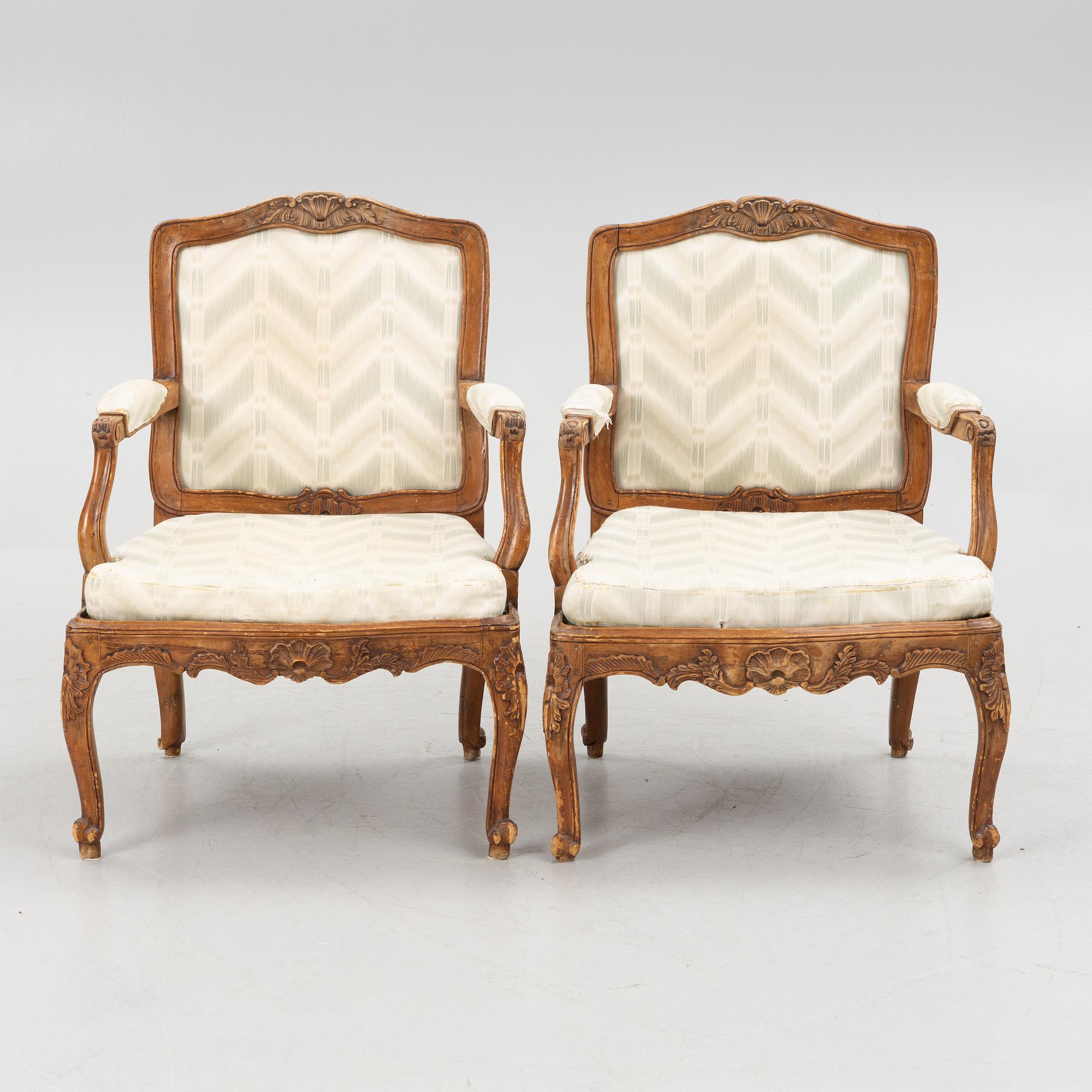 A pair of French Louis XV fauteuils, mid 18th century.