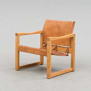 A leather and pinewood easy chair by Karin Moberg, for IKEA, late 20th century.