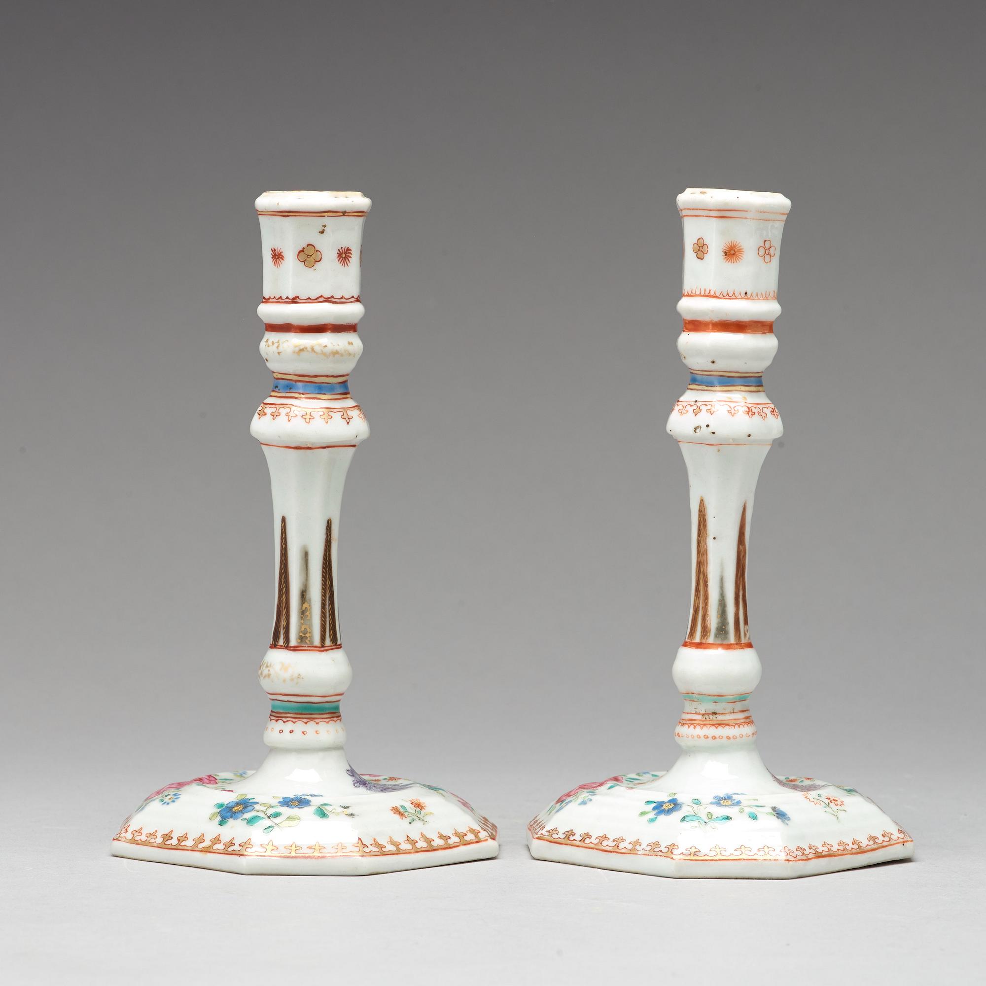 A pair of famille rose candle sticks, Qing dynasty, Qianlong (1736-95).