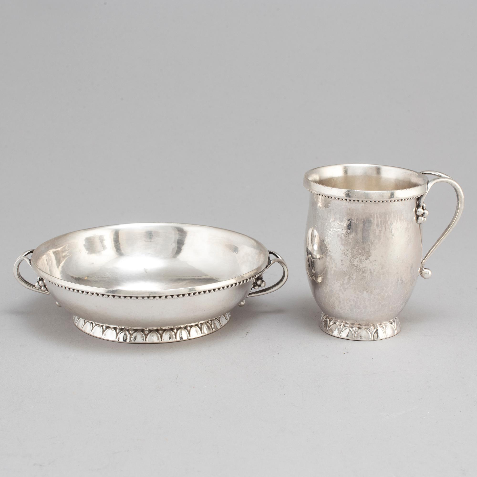 GEORG JENSEN,  a 830/1000 silver mug and  a bowl (a christening set), Copenhagen ca 1918-1927, design nr 127, 158.