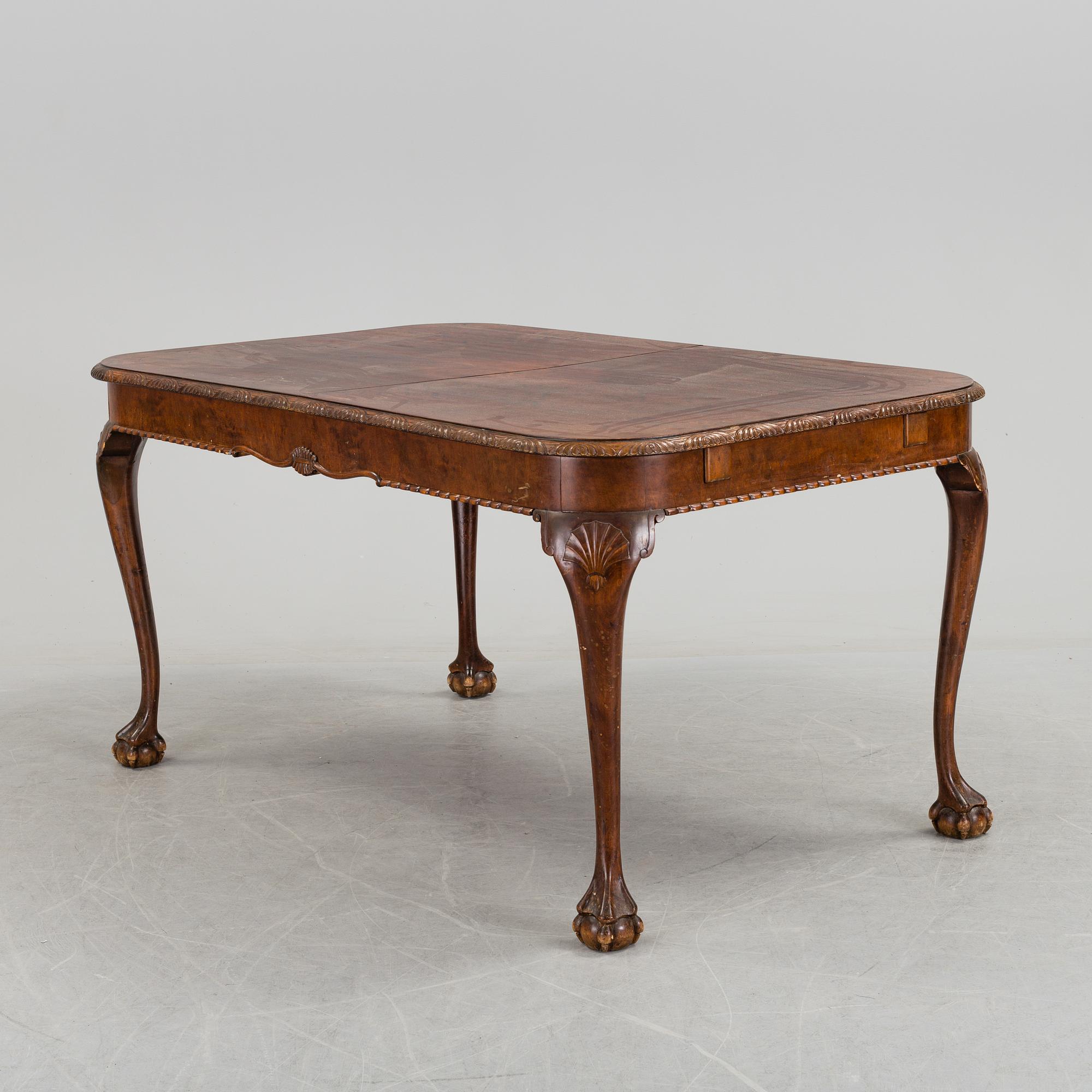 A 1920's 7 piece Chippendale-style dining group.