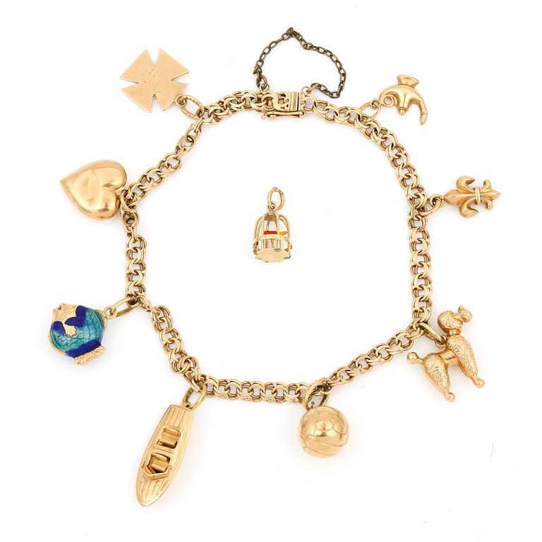 ARMBAND MED BERLOCKER, guld mest 18K, JP, Stockholm 1947. Vikt ca 14 gram.