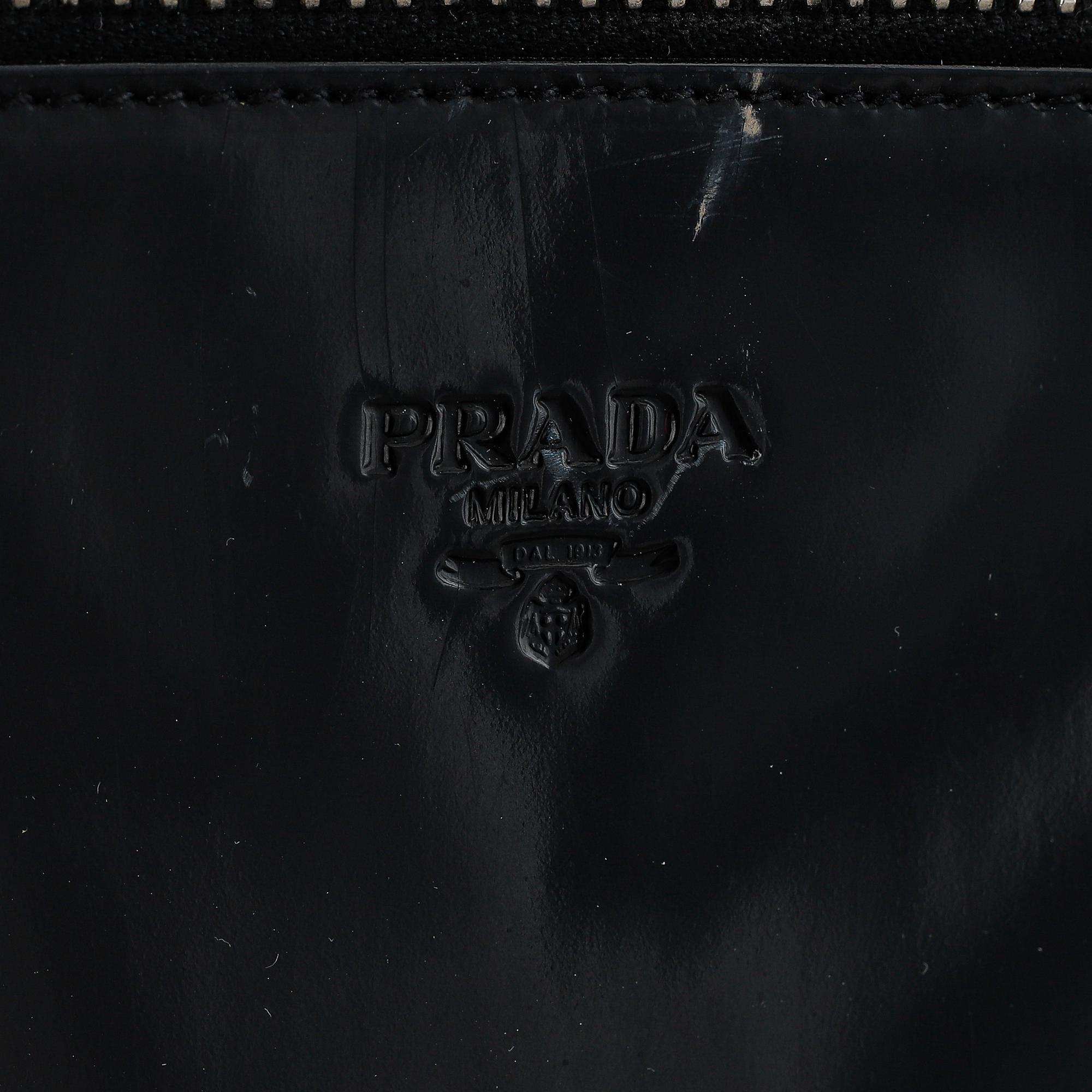 Prada, a patent leather bag.