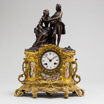 A Rococo style mantle clock, circa 1900.