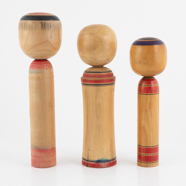 Four Japanese Kokeshi dolls, 20th Century.