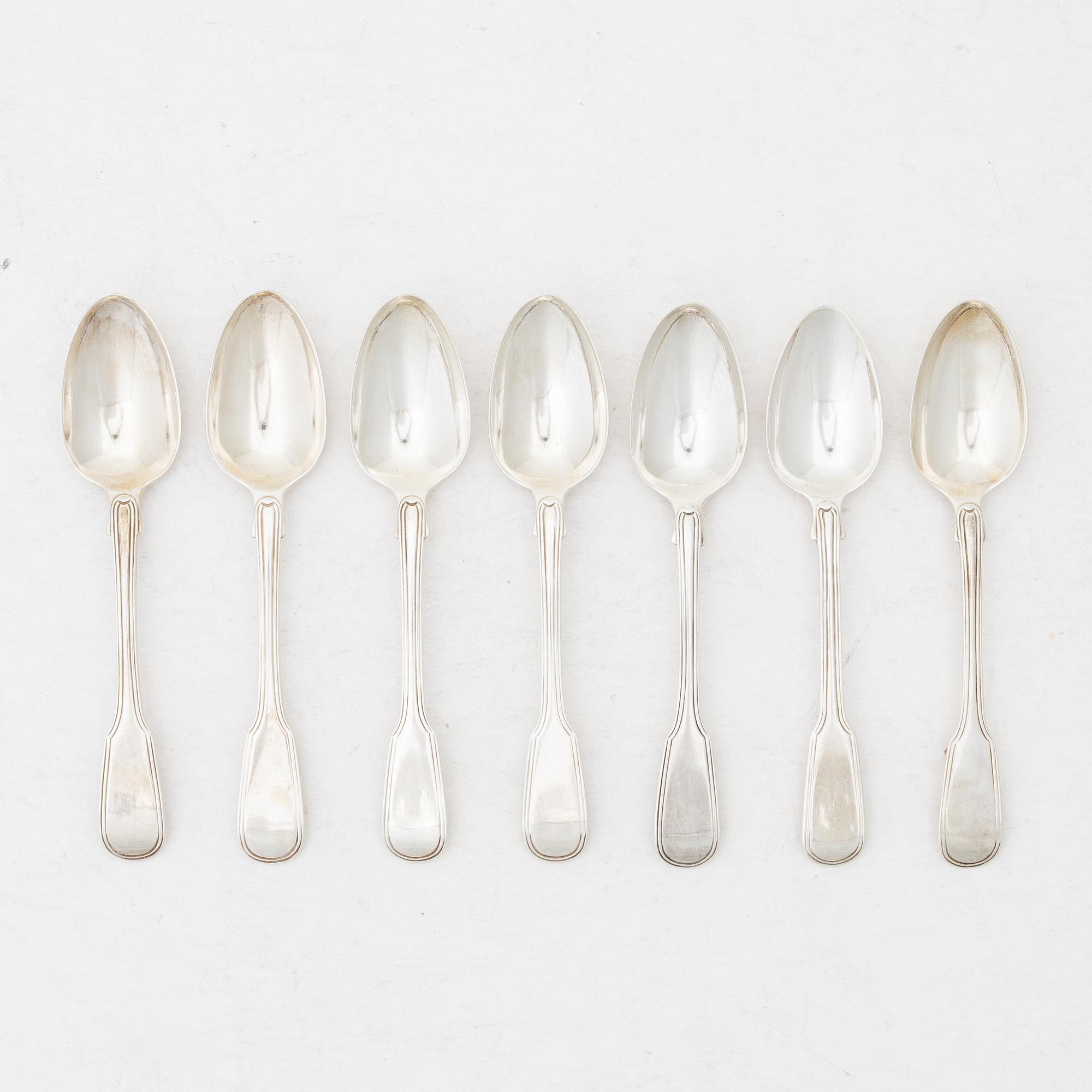 Seven silver spoons, French model, mostly William Comyns, London 1916.