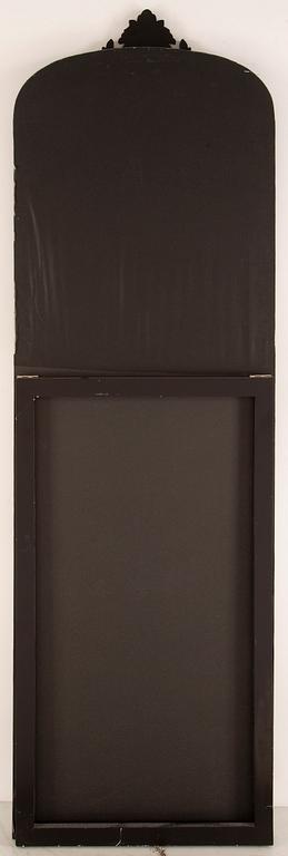 A contemporary floor mirror.