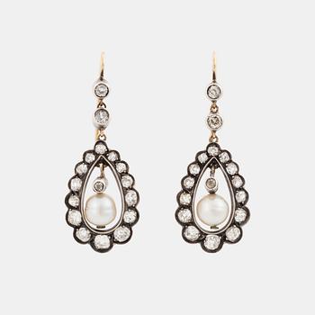 511. A pair of silver and gold earrings set with old-cut diamonds and pearls.