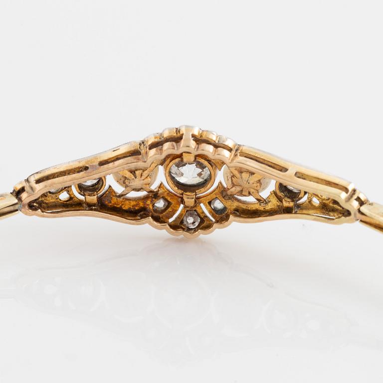 A 14K gold and platinum bracelet set with old- and rose-cut diamonds and pearls.