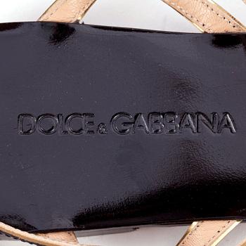 DOLCE & GABBANA, a pair of black leather sandals.