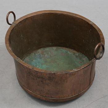 A 19th century copper cauldron.