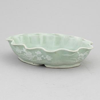 A Chinese celadon glazed lotus leaf shaped bowl, late Qing dynasty, and a ge-glazed brush washer, possibly 20 century.