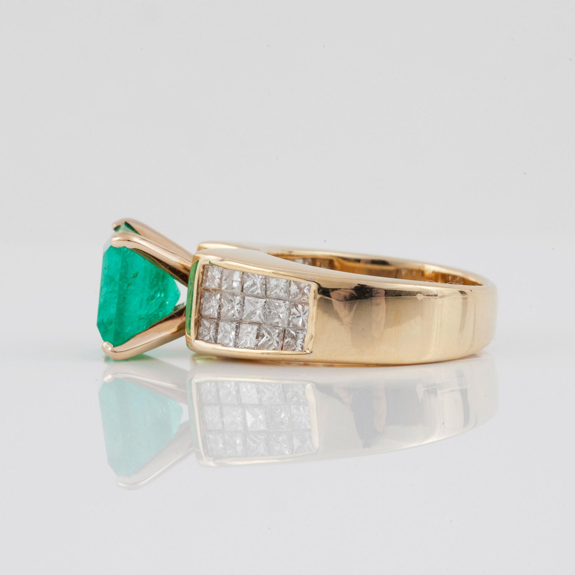 An emerald, circa 3.5 cts, and diamond, circa 1.95 cts, ring.