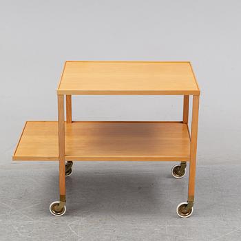 A walnut drink cart designed by Josef Frank for Firma Svenskt Tenn.