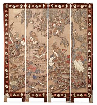 A coromandel black-lacquer four panel screen, Qing Dynasty (1644-1912).