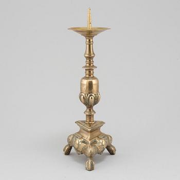 A 17th century bronze candlestick.