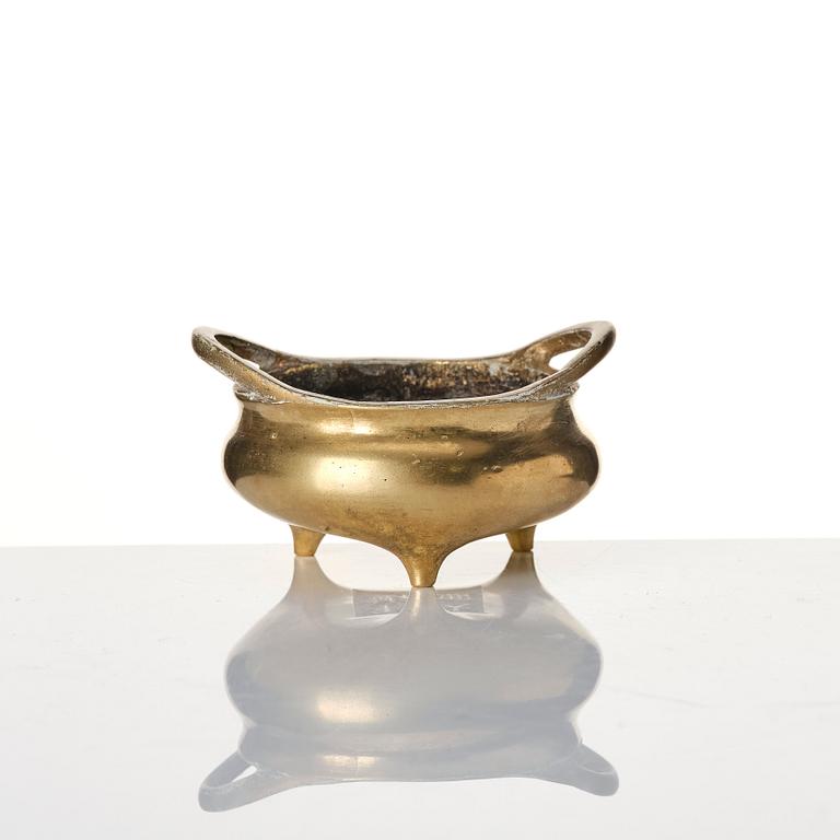 A small tripod censer, a temple bell and a tea pot with cover, Qing dynasty.