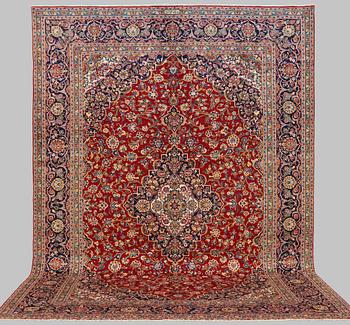 A CARPET, Kashan, signed 432 x 310 cm.