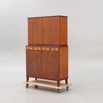 Carl Malmsten, a mahogany-veneered cabinet, AB J.O. Carlsson Möbelindustri, Vetlanda, sweden, around mid 20th century.