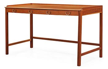 A Josef Frank mahogny desk by Svenskt Tenn.