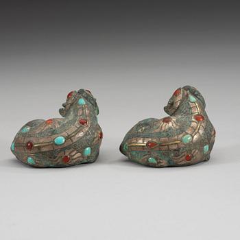 Two archaistic bronze weights with stone inlay, China.